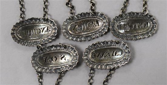 A set of five silver sauce labels by Reily & Storer;